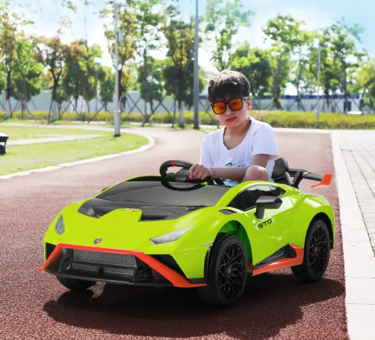 A kid is riding the Tobbi 12V Licensed Lamborghini Kids Ride on Car, Green.