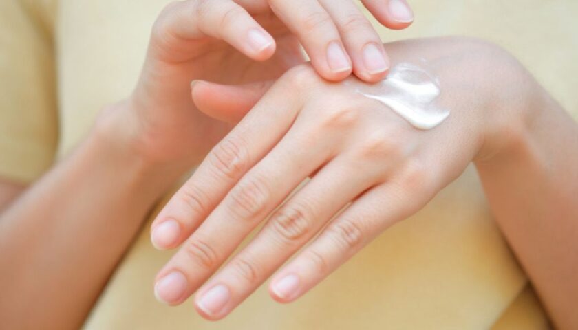 Women apply hand cream