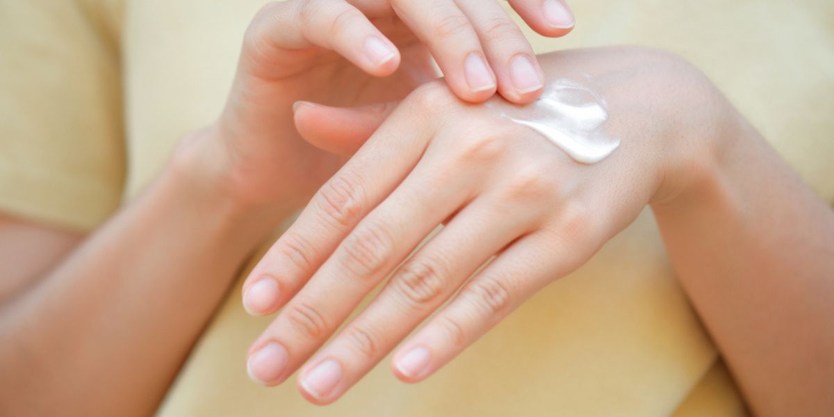 Women apply hand cream
